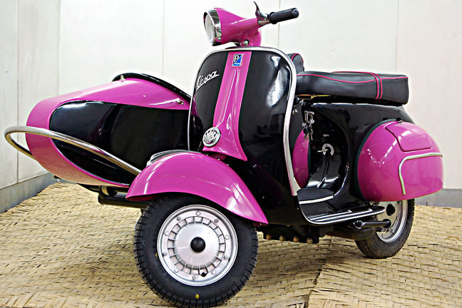 pink vespa with sidecar